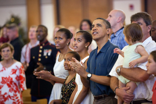 President Barack Obama and first lady Michelle Obama, with daughters Sasha and Malia, attend Christmas services at the Marine Corp Base Hawaii chapel in Kaneohe Bay, Hawaii, on Dec. 25, 2011. Official White House photo by Pete Souza